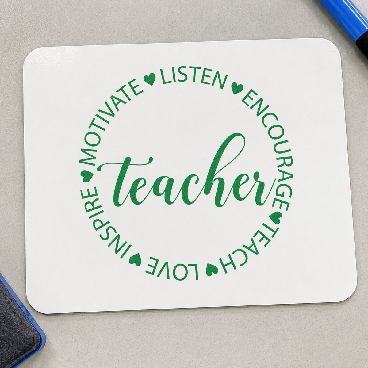 Teacher Motivate Inspire Circle craft stamp imprint in green ink on a handmade project, one idea being framed ceiling tile.