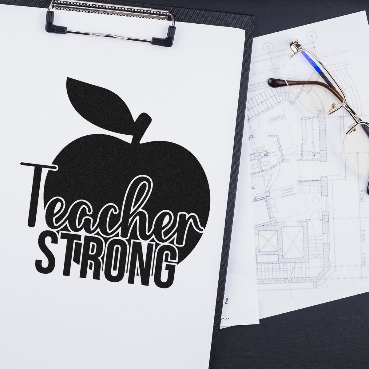 Premium Wooden Teacher Strong Apple Script Lettering Stamp - Vintage Pro imprint stamped in black ink. A large solid apple forms the backdrop to "Teacher strong" in script and block lettering.