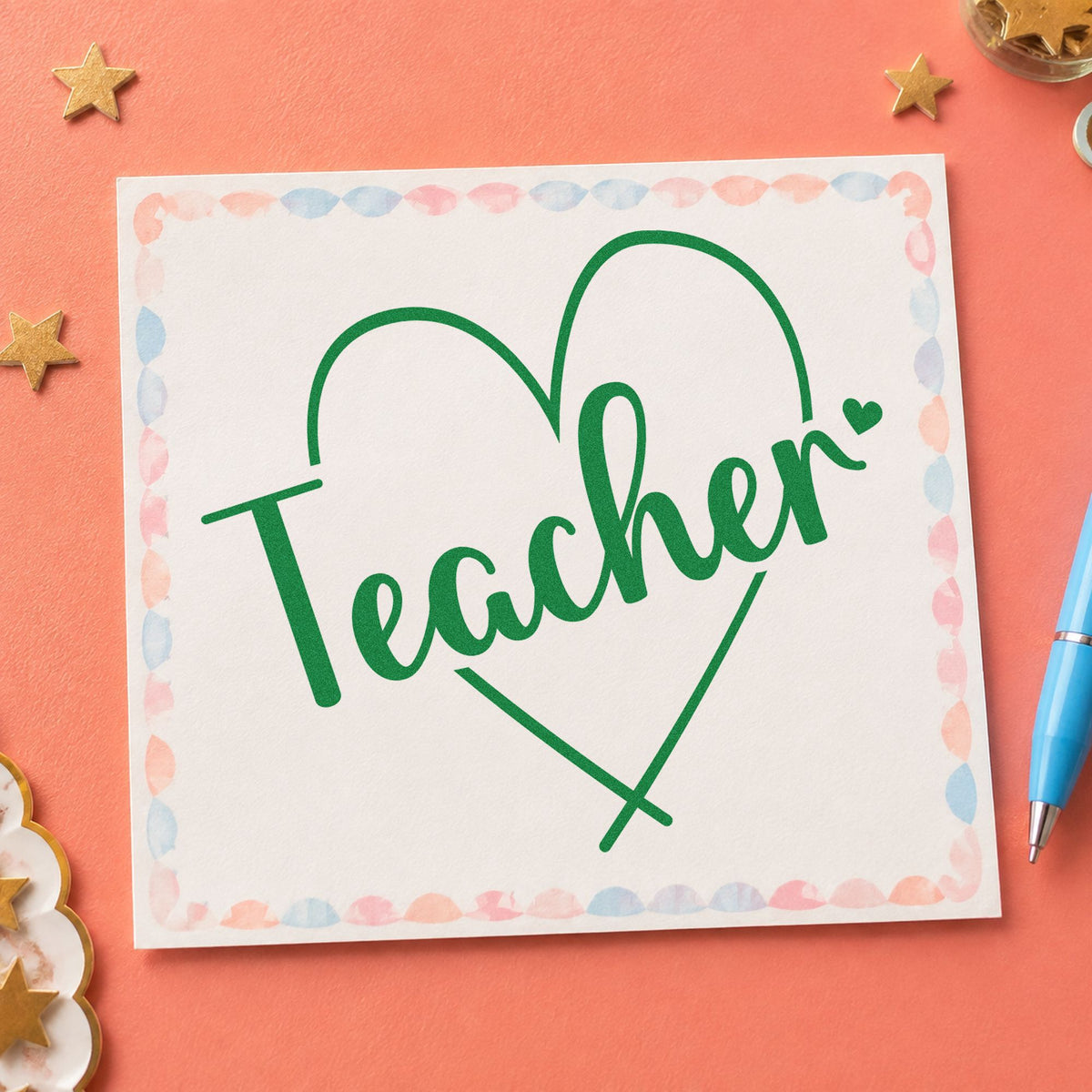 Teacher Heart Outline craft stamp imprint in green ink on a handmade project, one idea being framed nook outline.