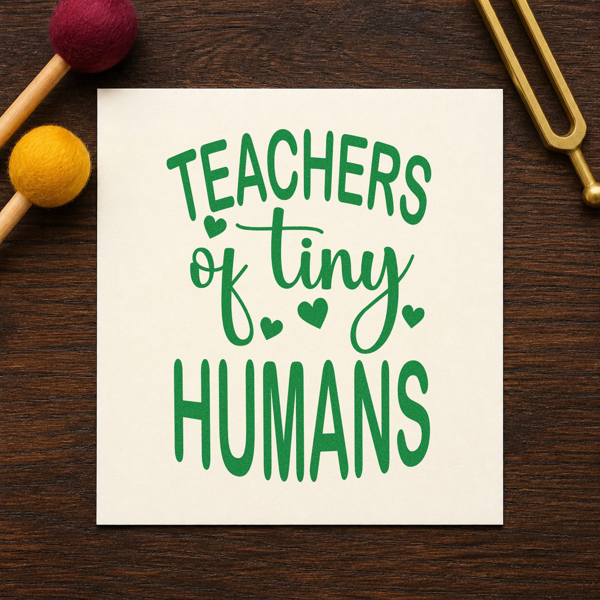 Teachers of Tiny Humans craft stamp imprint in green ink on a handmade project, one idea being framed circle time.