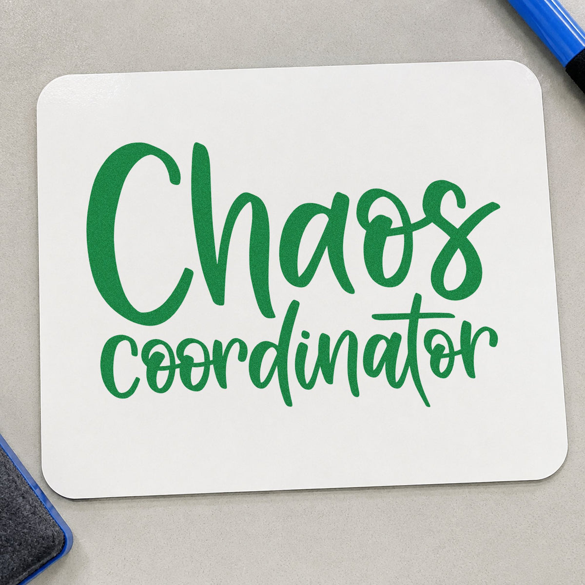 Chaos Coordinator craft stamp imprint in green ink on a handmade project, one idea being seating chart pages.