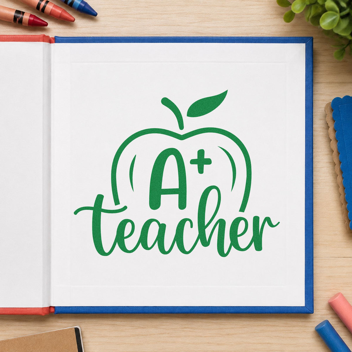 A Plus Teacher Apple craft stamp imprint in green ink on a handmade project, one idea being rubric sheet pages.