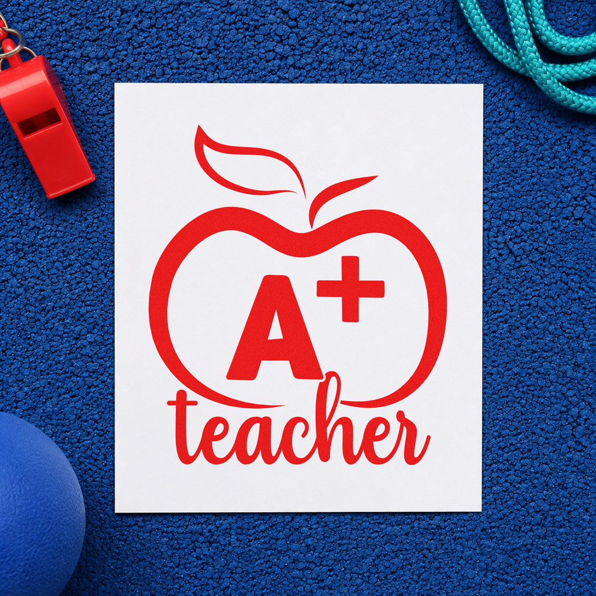 A Plus Teacher Outline Apple rubber stamp shown in red ink, stamped for projects such as valedictorian notes.