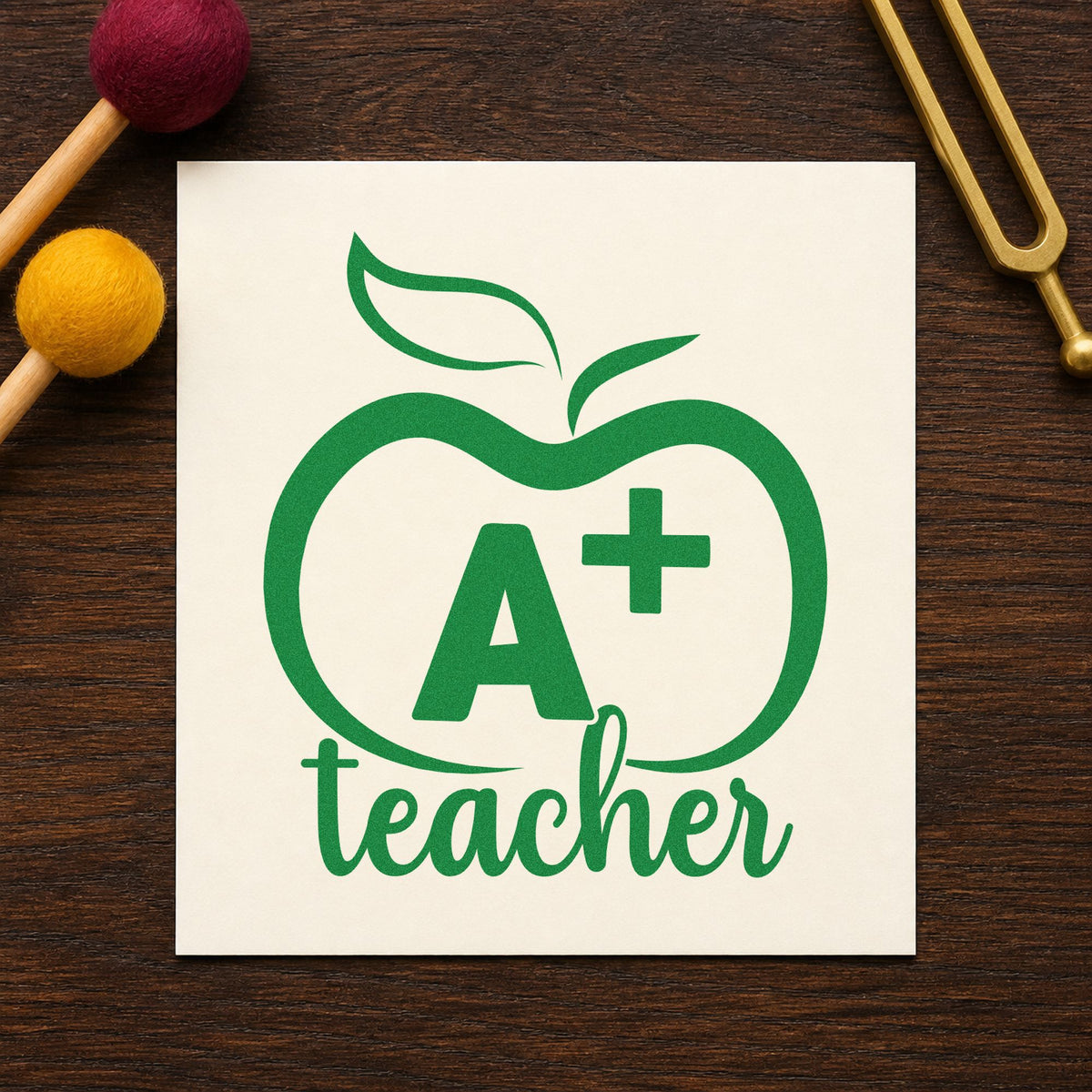 A Plus Teacher Outline Apple Wood Handle Stamp in use 8