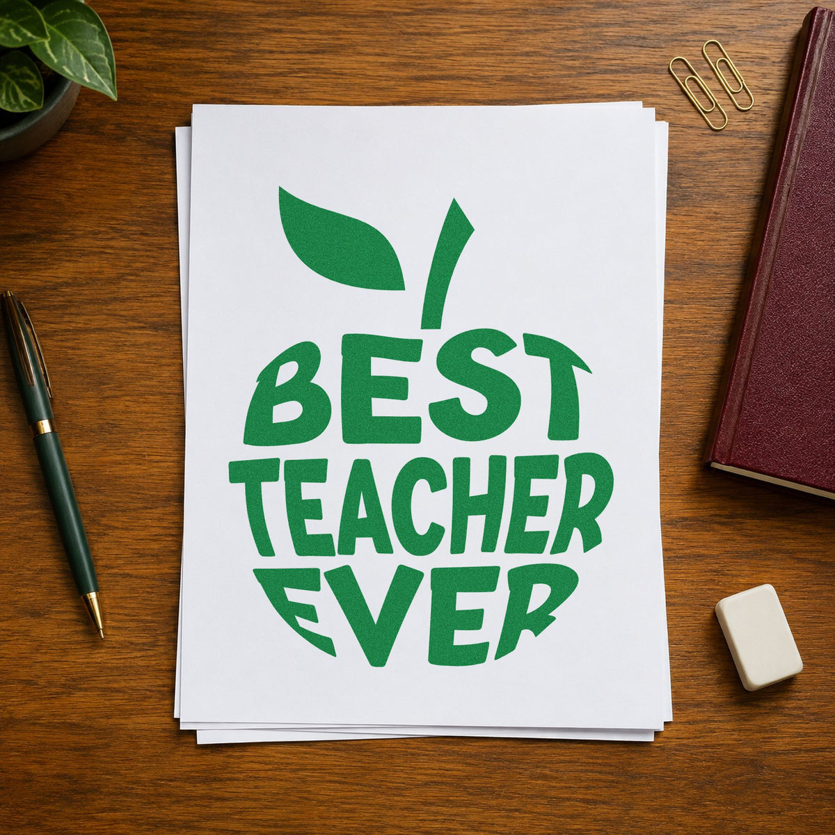 Best Teacher Ever Apple craft stamp imprint in green ink on a handmade project, one idea being shaped album pages.