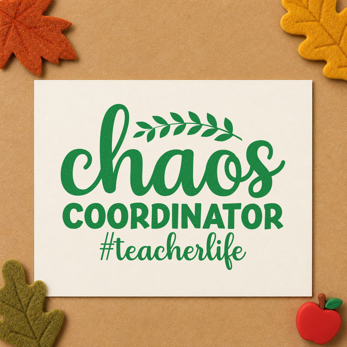 Chaos Coordinator Teacher Life craft stamp imprint in green ink on a handmade project, one idea being framed flat lay.