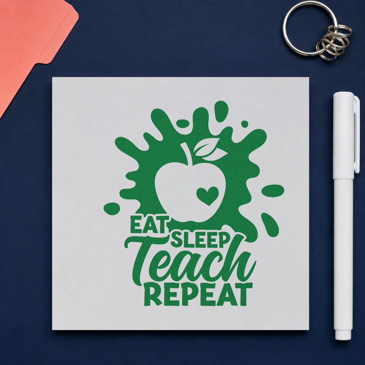 Eat Sleep Teach Repeat Splash craft stamp imprint in green ink on a handmade project, one idea being summer plan pages.