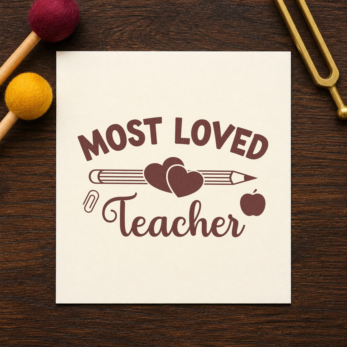 Most Loved Teacher rubber stamp printed in brown ink, ready for heart clip crafts and similar paper crafts.