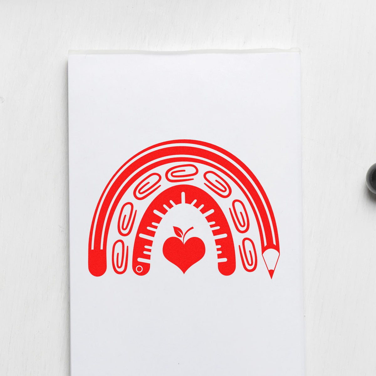 School Supply Rainbow rubber stamp shown in red ink, stamped for projects such as donation drive tags.