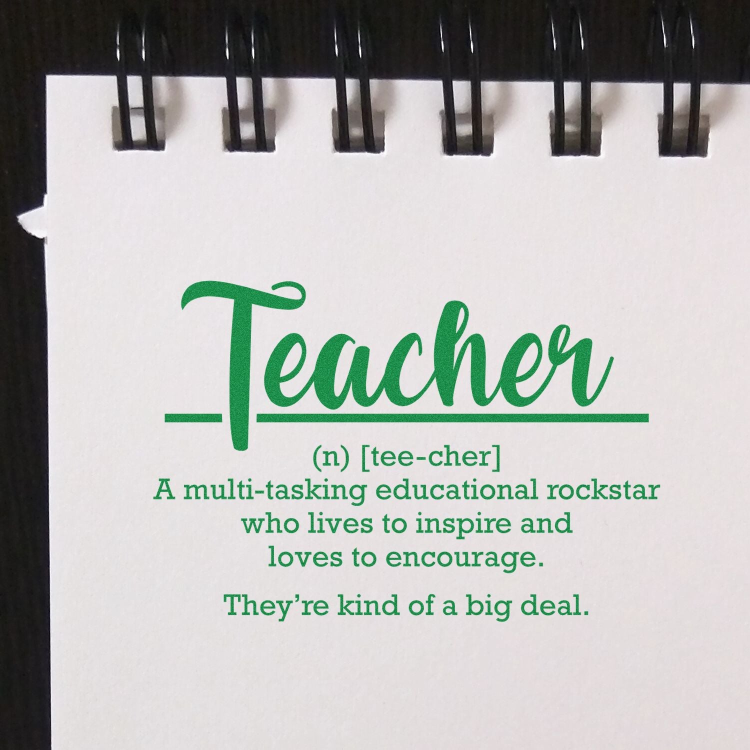 Teacher rubber stamp design with inspirational definition, ideal for classroom stationery and teacher appreciation gifts.