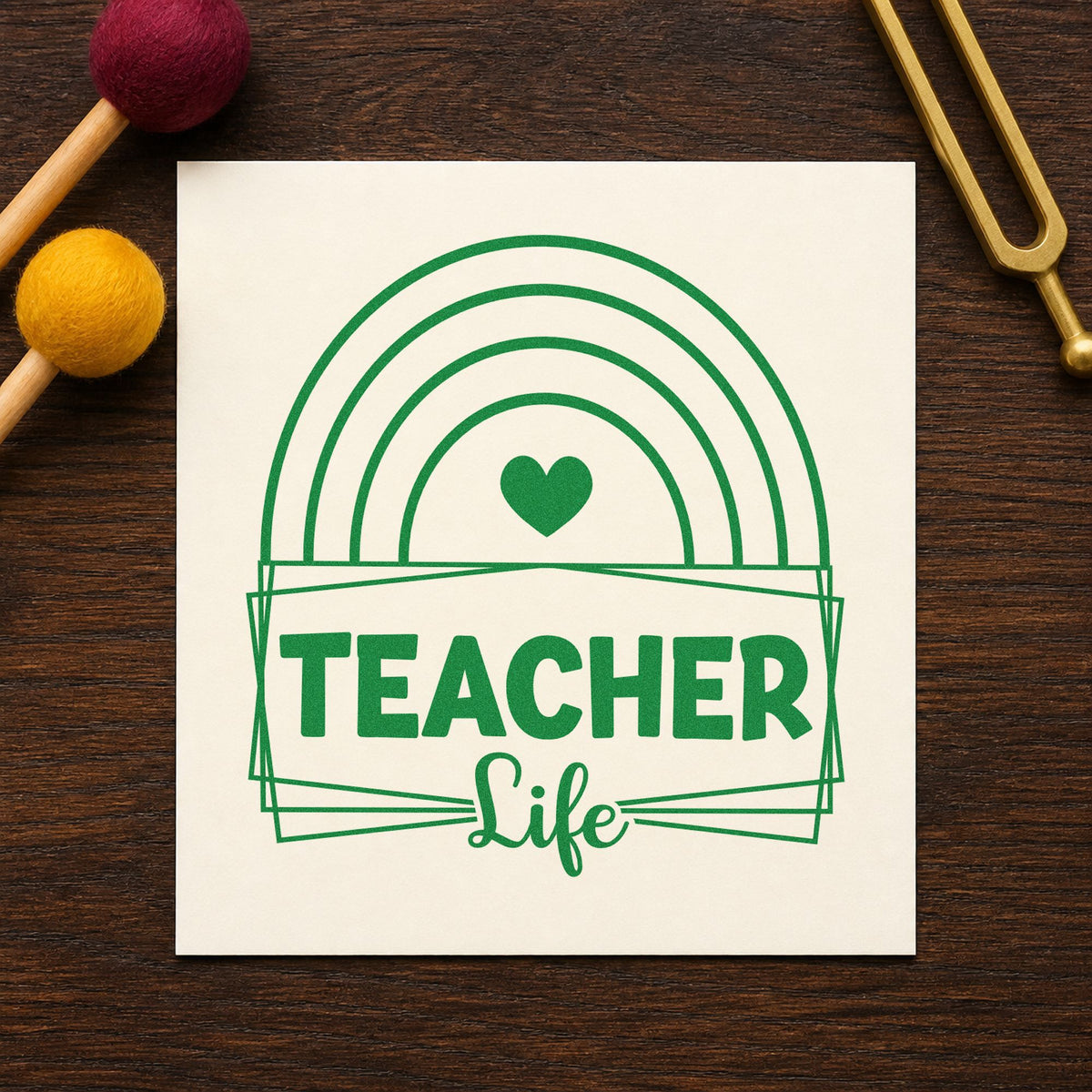 Teacher Life Rainbow Frame craft stamp imprint in green ink on a handmade project, one idea being chart header pages.