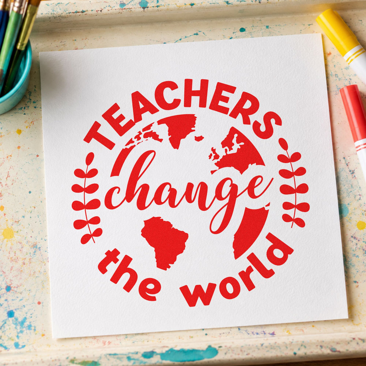 Teachers Change World Globe rubber stamp shown in red ink, stamped for projects such as tree planting notes.