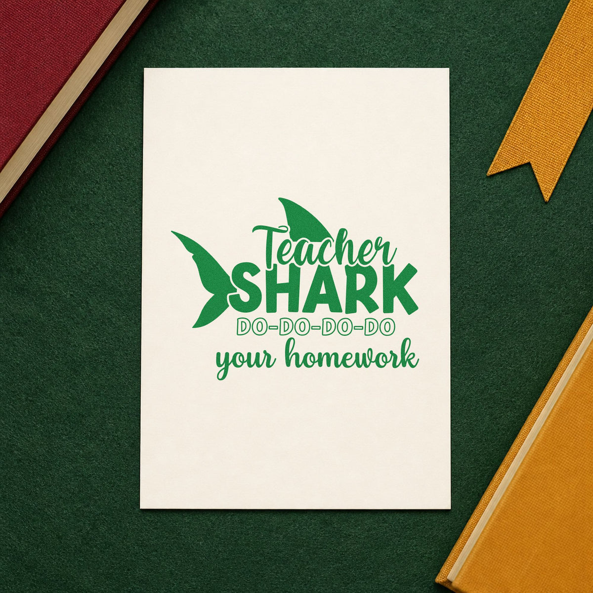 Teacher Shark Homework craft stamp imprint in green ink on a handmade project, one idea being framed reading den.