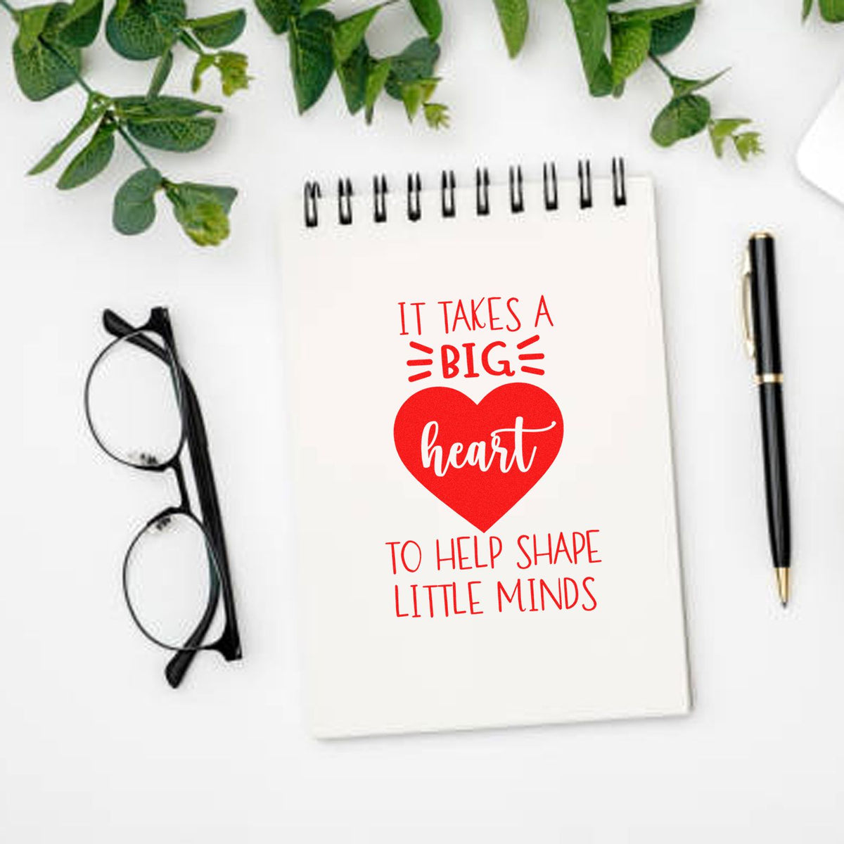 Big Heart Helps Little Minds rubber stamp shown in red ink, stamped for projects such as settling in tags.