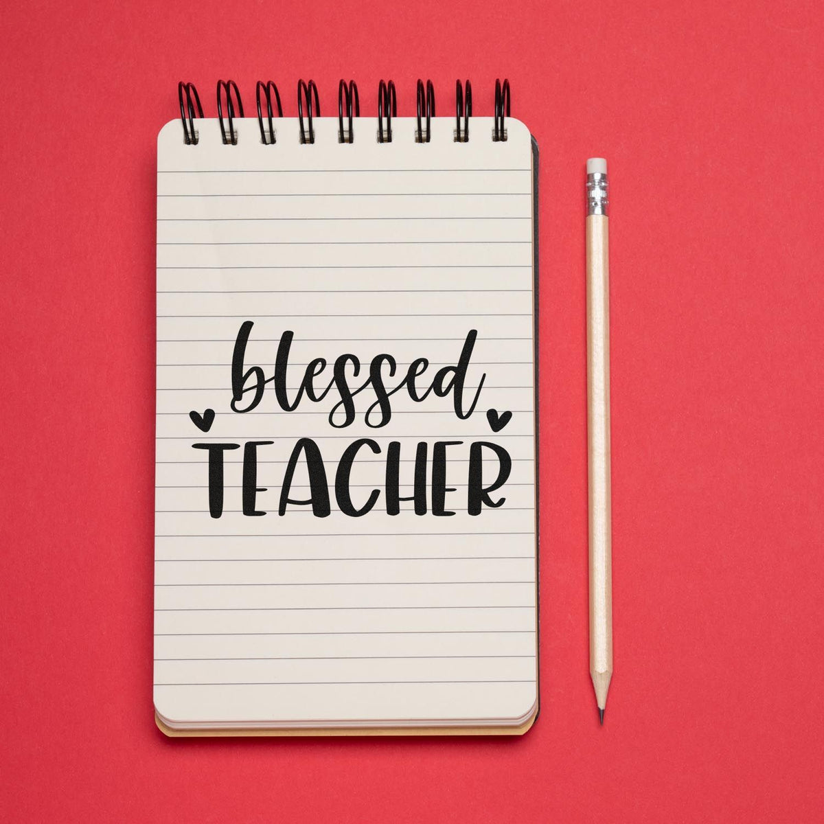 Premium Wooden Blessed Teacher Hearts Script Lettering Stamp - Vintage Pro imprint stamped in black ink. Two small hearts flank "Blessed" script above bold "Teacher."