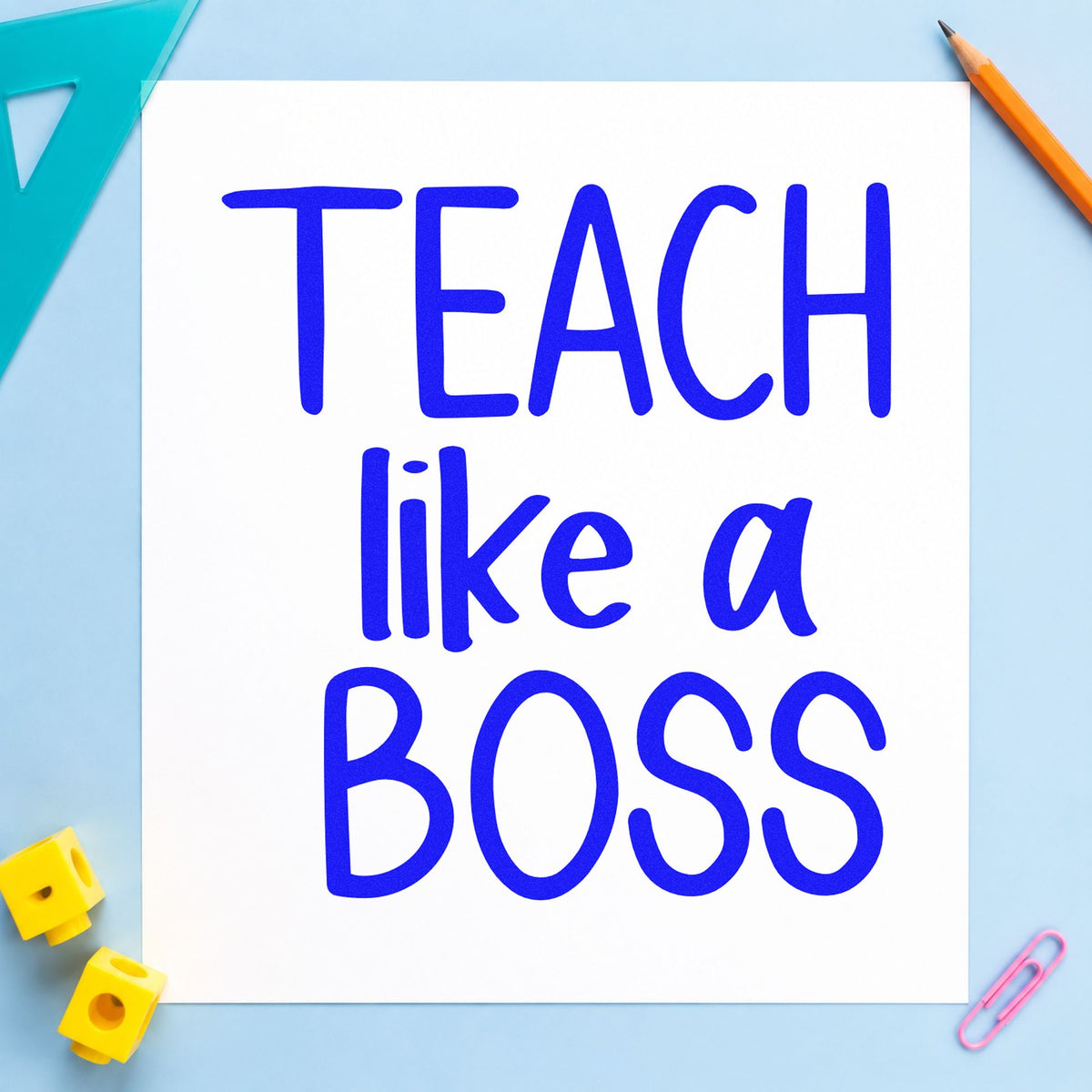 Teach Like a Boss Block craft stamp in blue ink on cardstock, an easy option for plain tote panels.