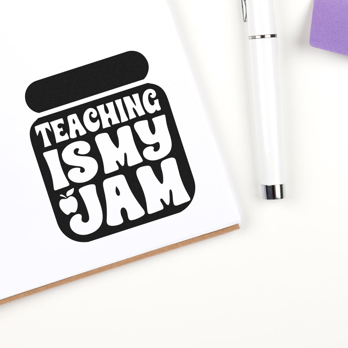 Teaching Is My Jam Solid Jar Apple Stamp - Premium Vintage Pro Wooden imprint stamped in black ink. White "Teaching is my jam" lettering and a small apple fill a solid jar silhouette.