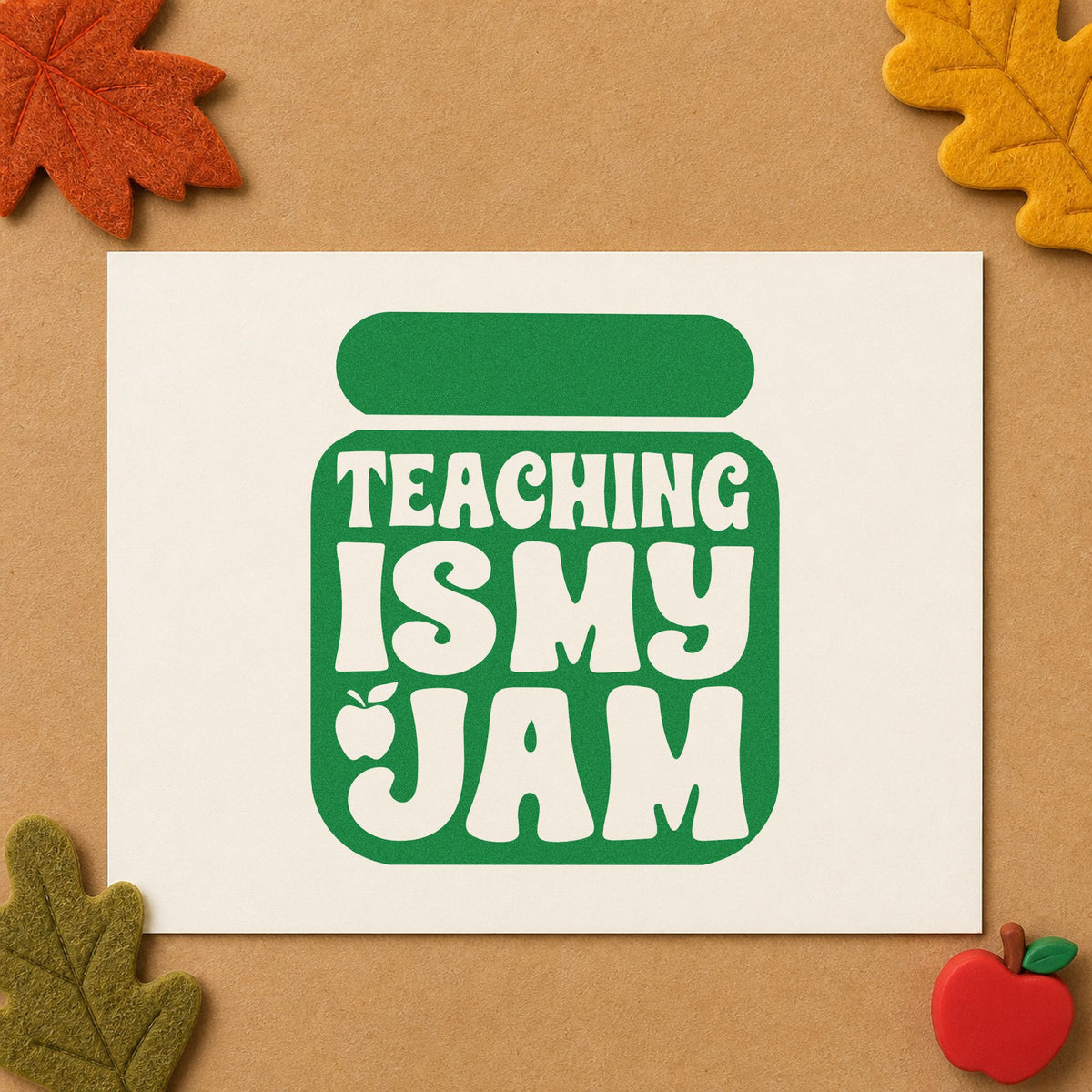 Teaching Is My Jam Solid Jar craft stamp imprint in green ink on a handmade project, one idea being framed dark shelf.