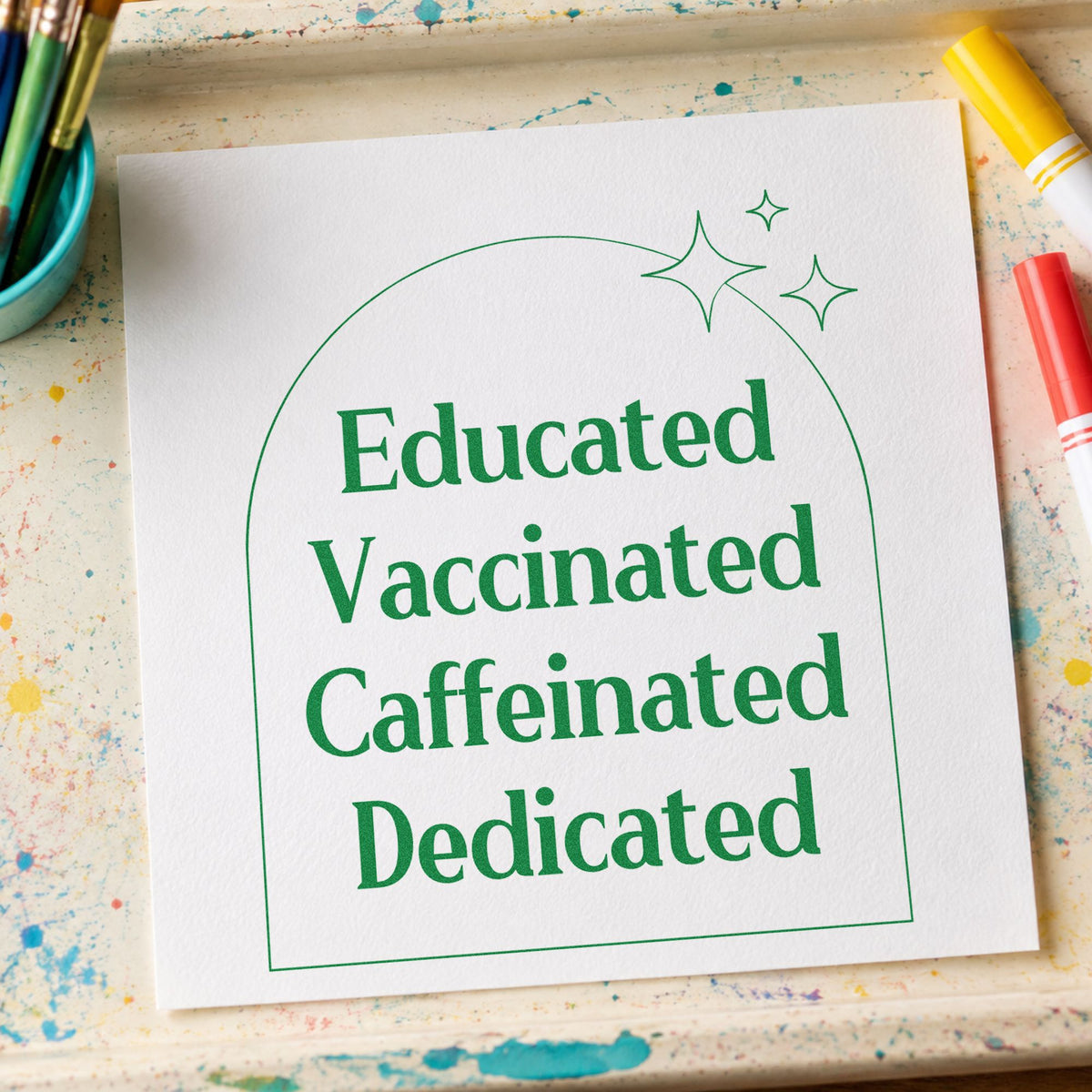 Educated Vaccinated Caffeinated Dedicated craft stamp imprint in green ink on a handmade project, one idea being assembly script pages.