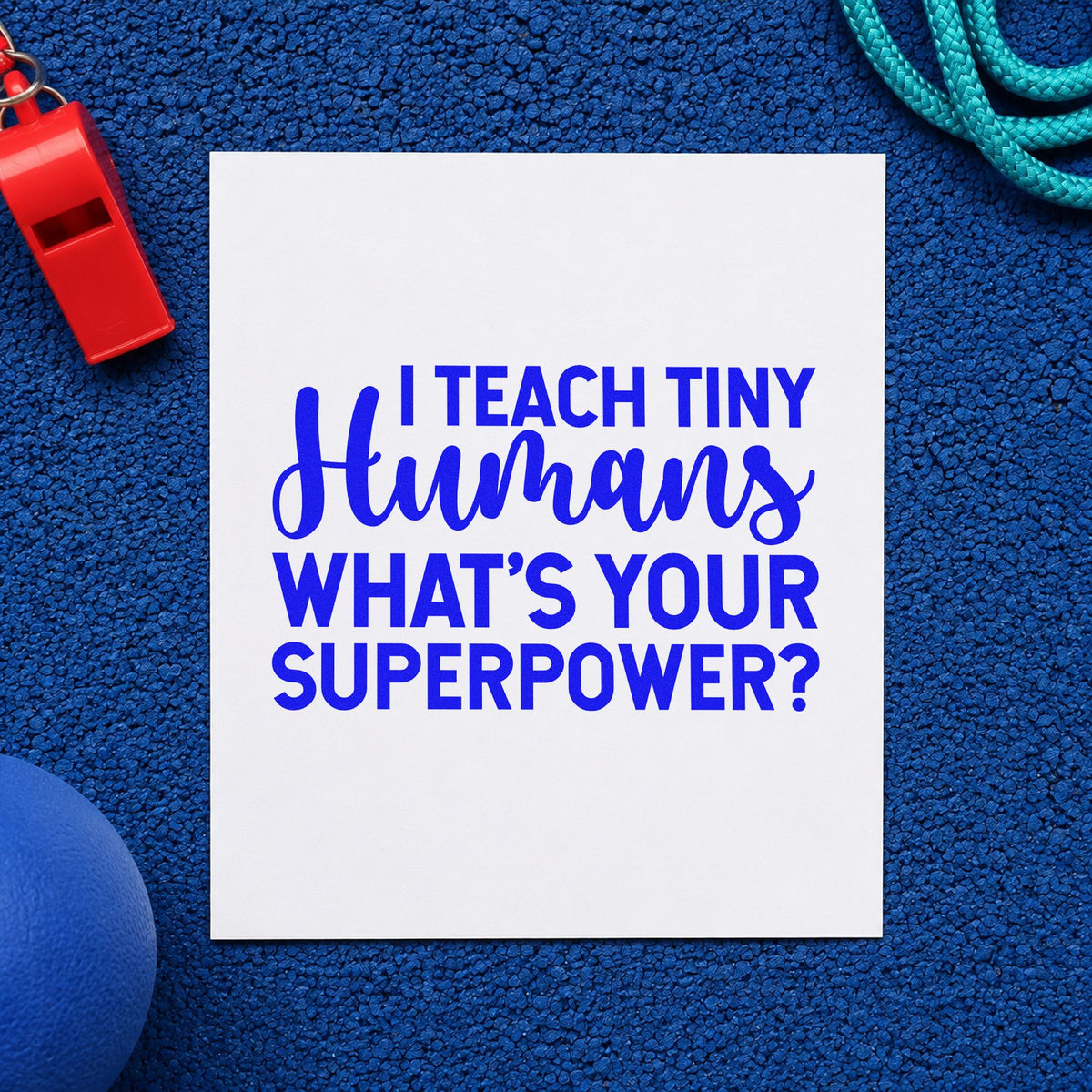 I Teach Tiny Humans craft stamp in blue ink on cardstock, an easy option for tabard back panels.
