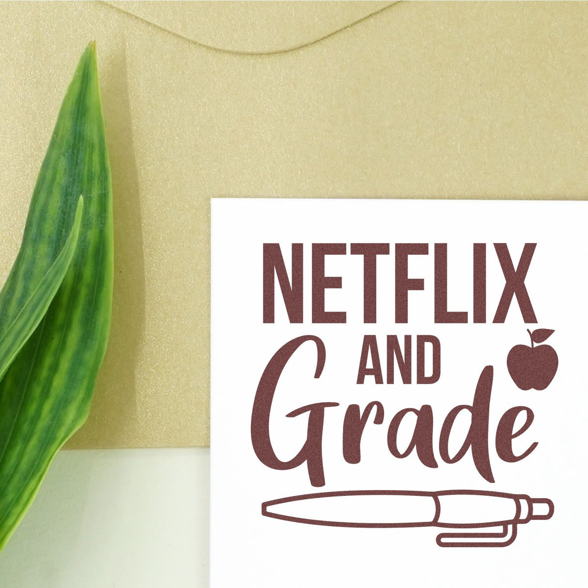Netflix And Grade Pen rubber stamp shown in brown ink, stamped for projects such as movie night tags.