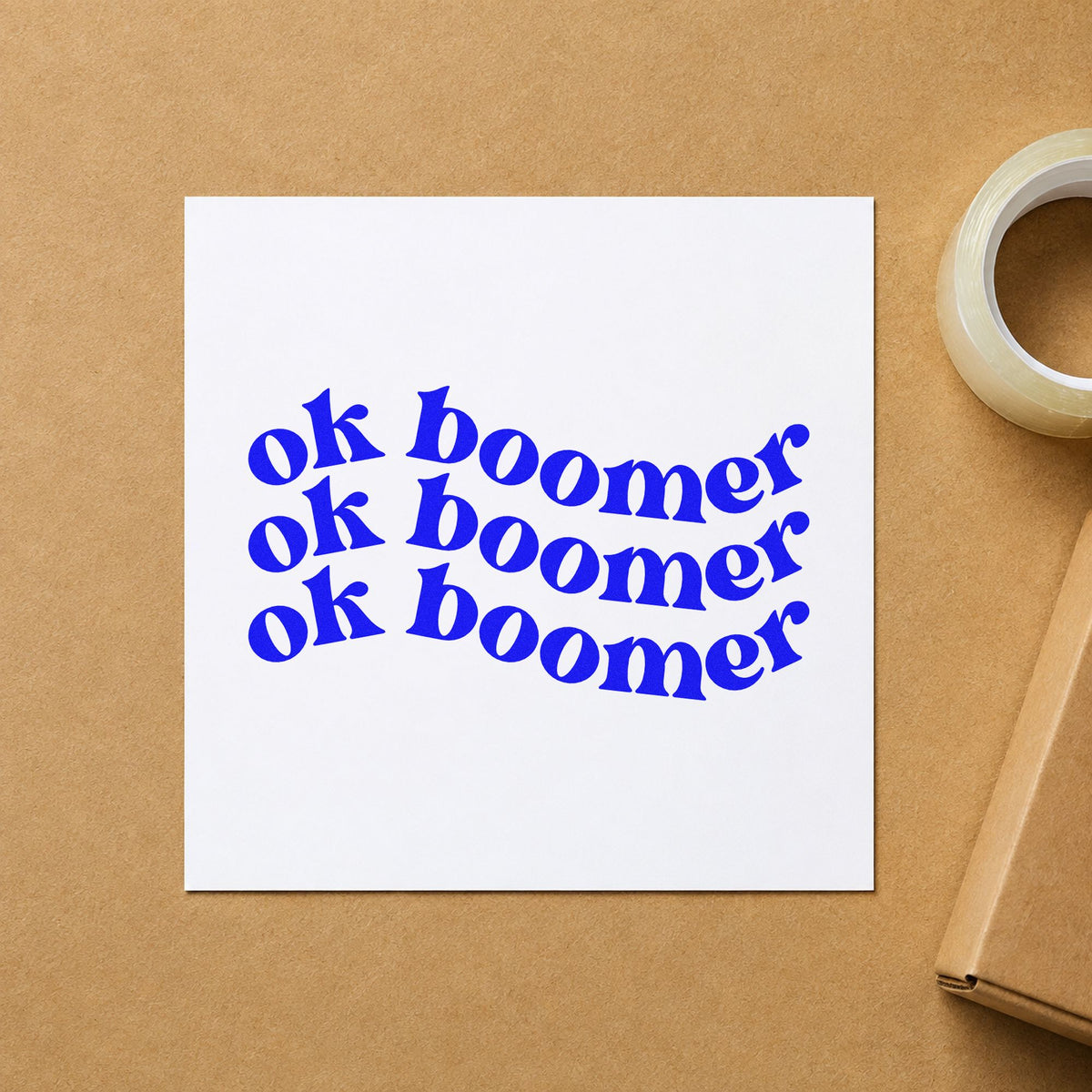 Repeated Wavy Ok Boomer craft stamp imprinted in blue ink on paper, a design suited to yearbook quote seals.