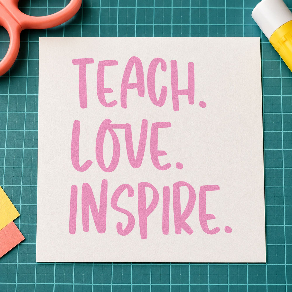 Teach Love Inspire Capitals craft stamp in purple ink on cardstock, an easy option for lino block tags.