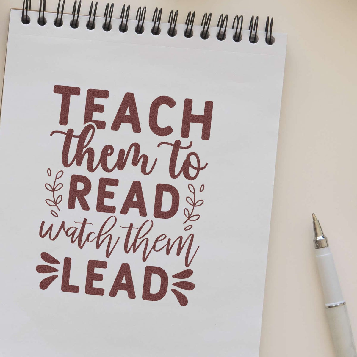 Teach Read Watch Lead rubber stamp shown in brown ink, stamped for projects such as book prize tags.