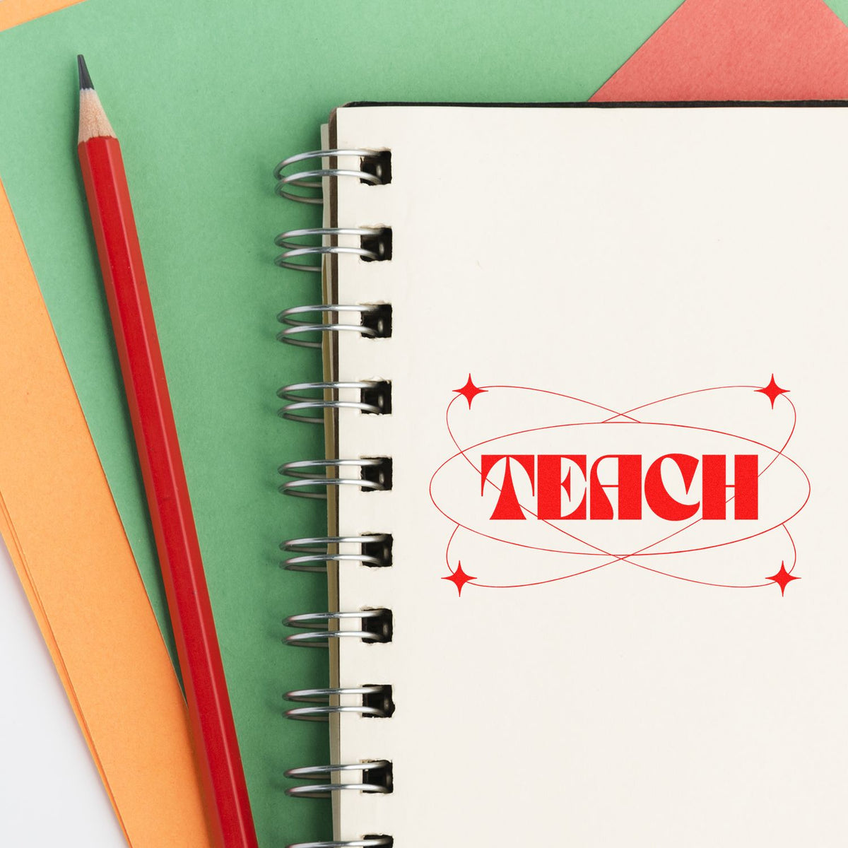Teach With Orbit Sparkles rubber stamp shown in black ink, stamped for projects such as rocket club tags.