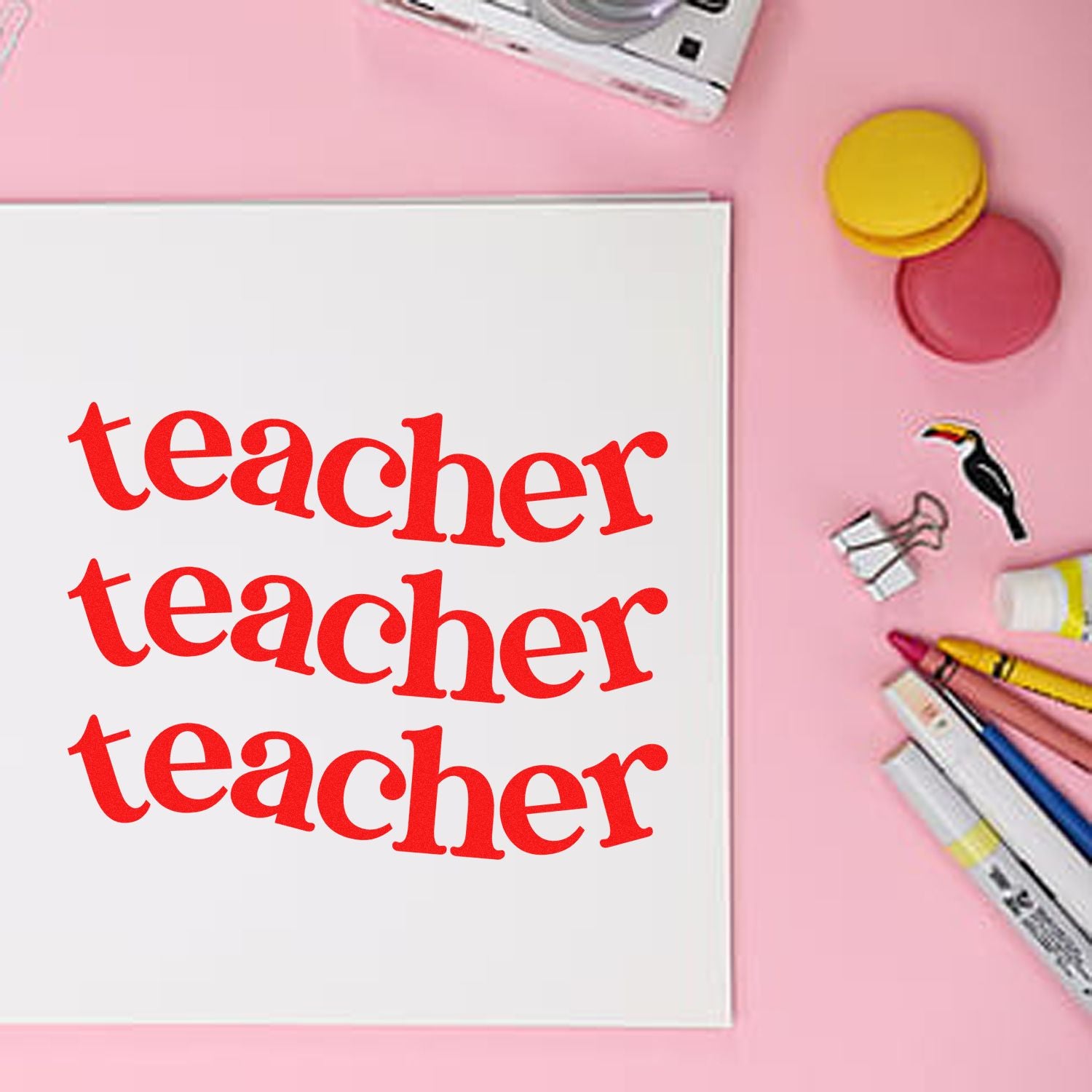 Teacher rubber stamp imprint on paper with art supplies, perfect for classroom grading, crafts, and teacher stationery.