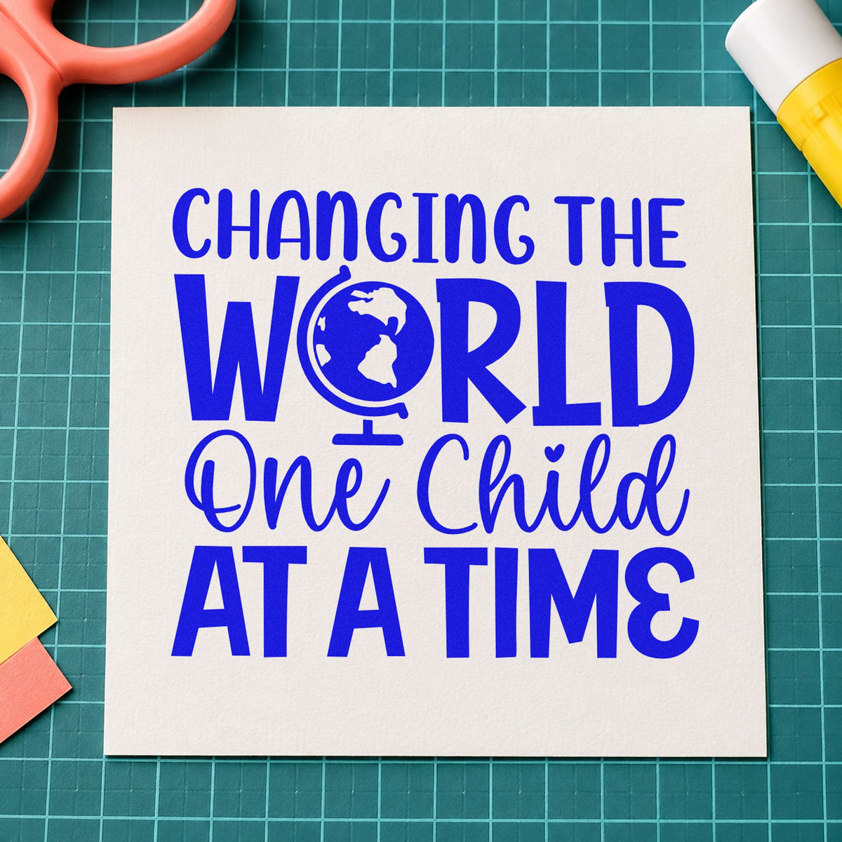 Changing World One Child craft stamp in blue ink on cardstock, an easy option for charity vest panels.