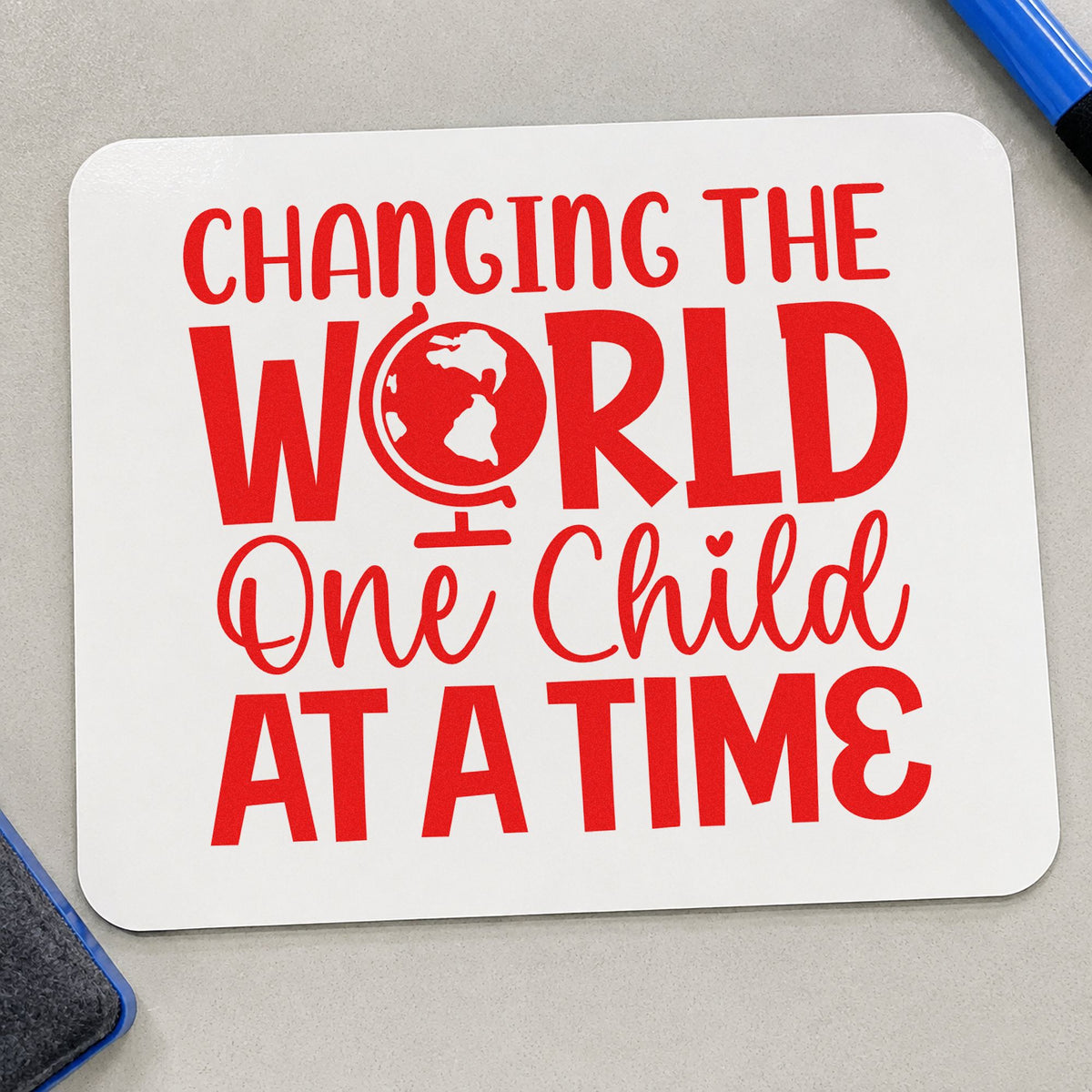 Changing World One Child rubber stamp shown in red ink, stamped for projects such as fundraiser notes.