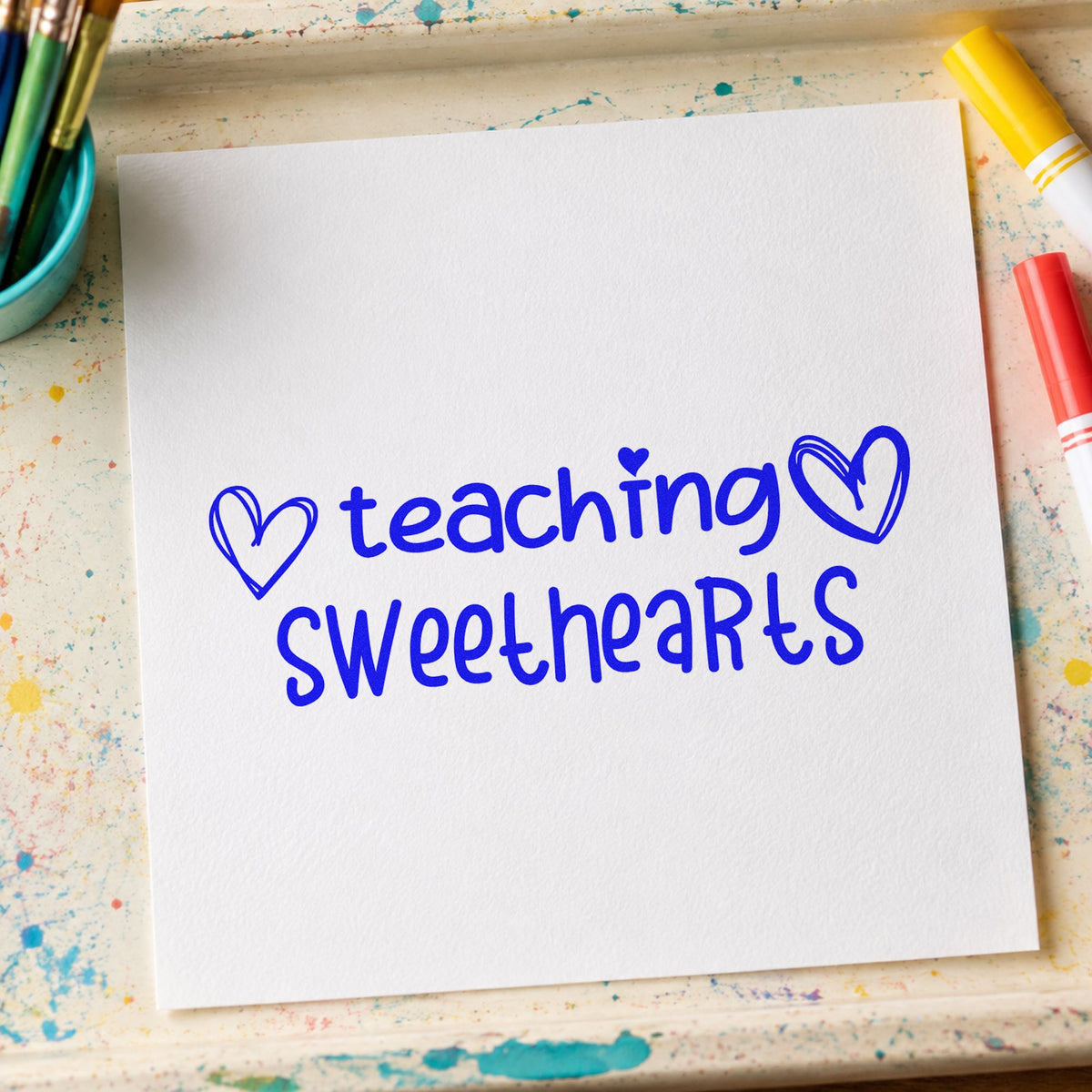 Teaching Sweethearts With Hearts craft stamp in blue ink on cardstock, an easy option for party apron panels.