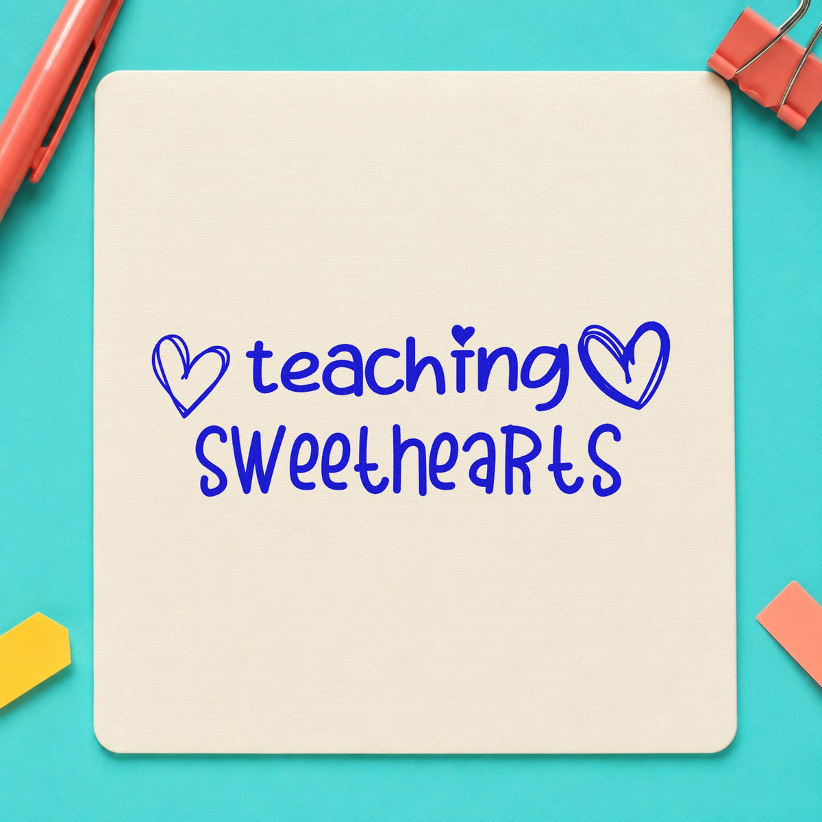 Teaching Sweethearts With Hearts craft stamp imprinted in blue ink on paper, a design suited to envelope tuck seals.