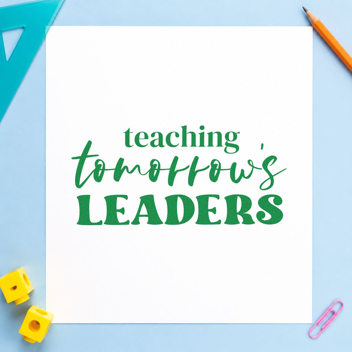 Teaching Tomorrow's Leaders craft stamp imprint in green ink on a handmade project, one idea being framed careers room.