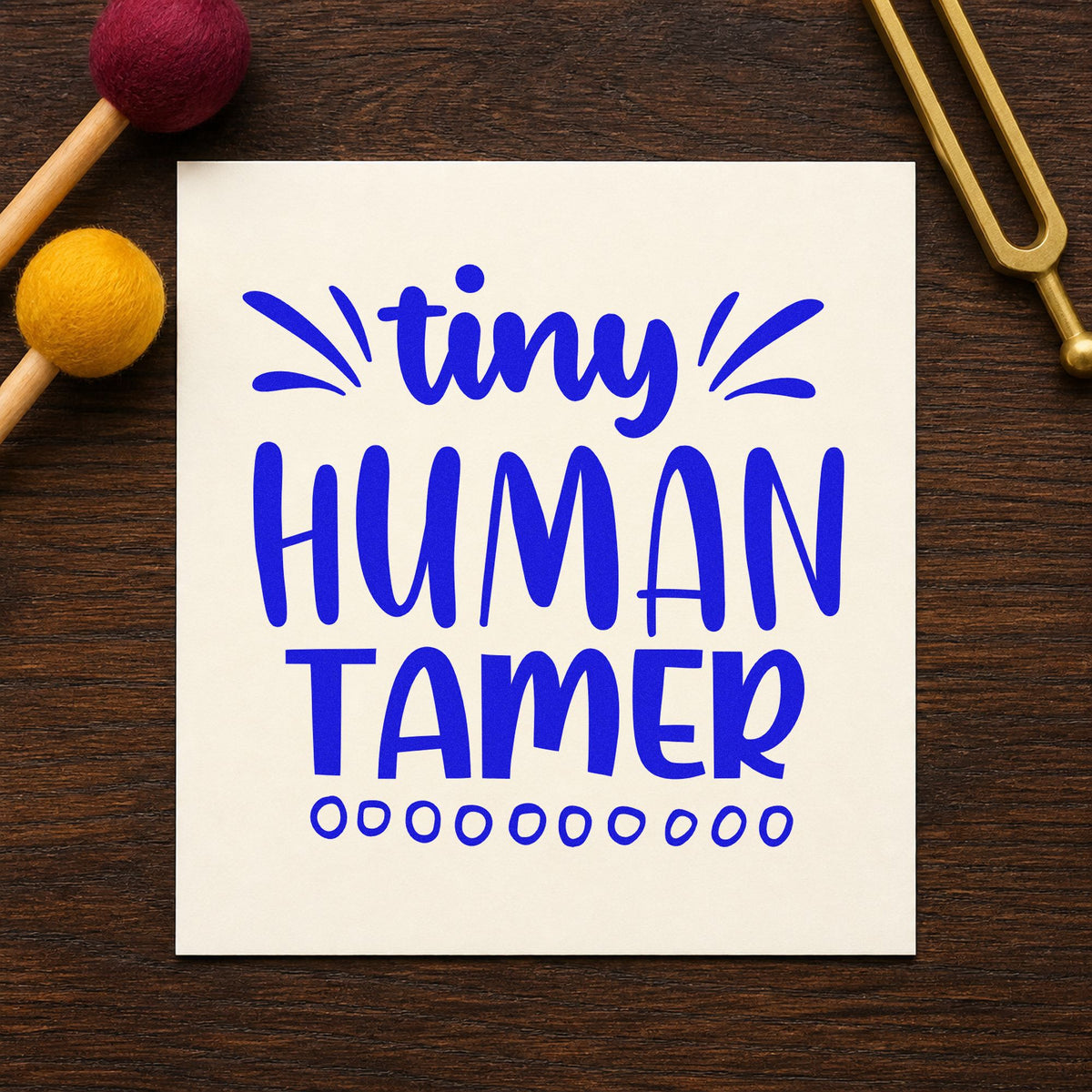 Tiny Human Tamer Lettering craft stamp in blue ink on cardstock, an easy option for floor mat panels.