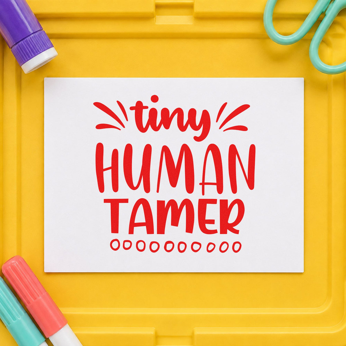 Tiny Human Tamer Lettering rubber stamp shown in red ink, stamped for projects such as settling in notes.