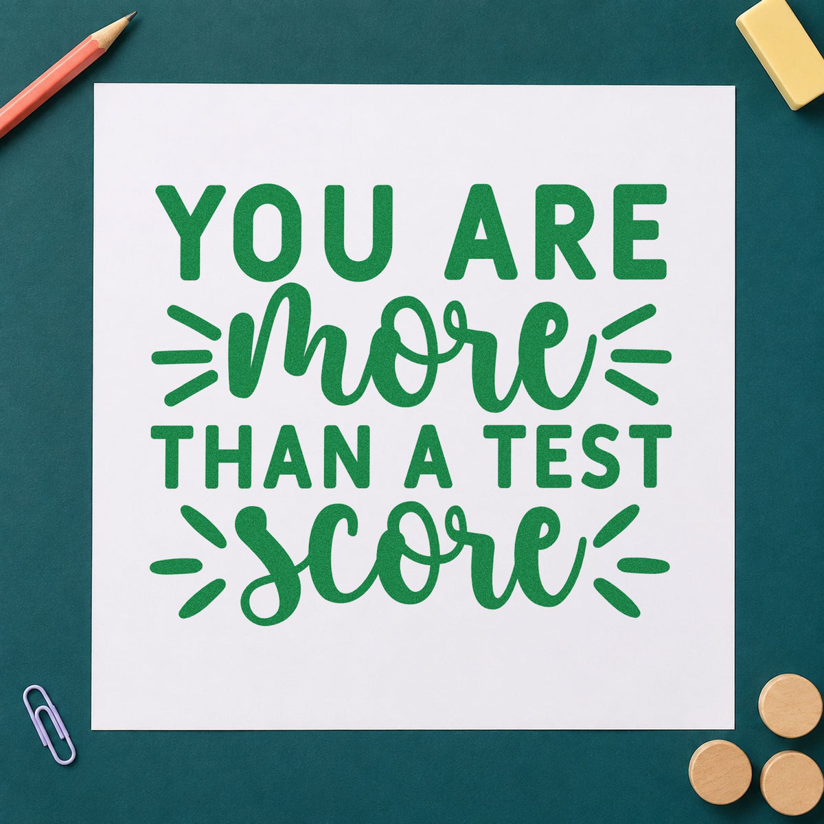 More Than Test Score craft stamp imprint in green ink on a handmade project, one idea being framed exam corridor.