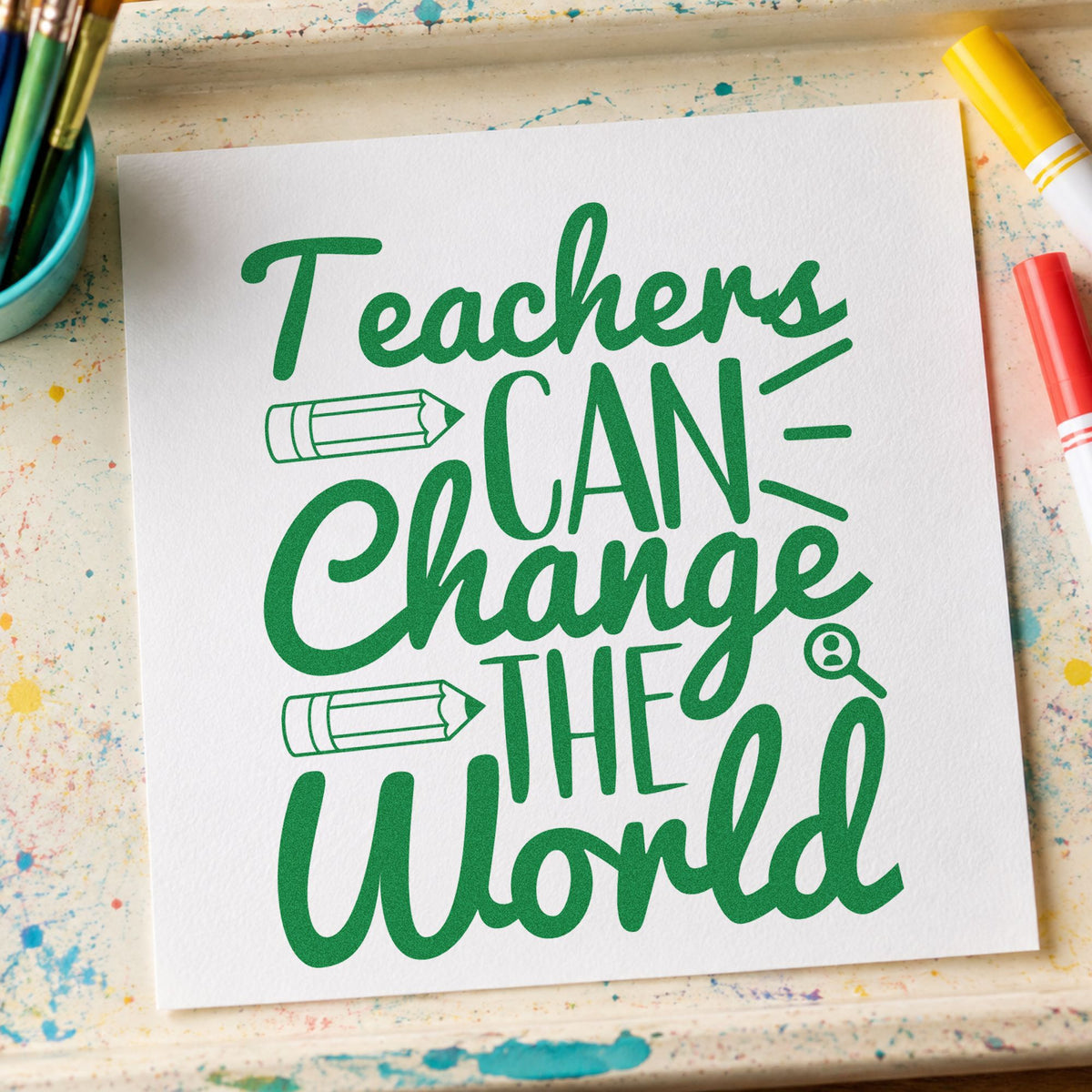 Teachers Can Change World craft stamp imprint in green ink on a handmade project, one idea being evidence log pages.