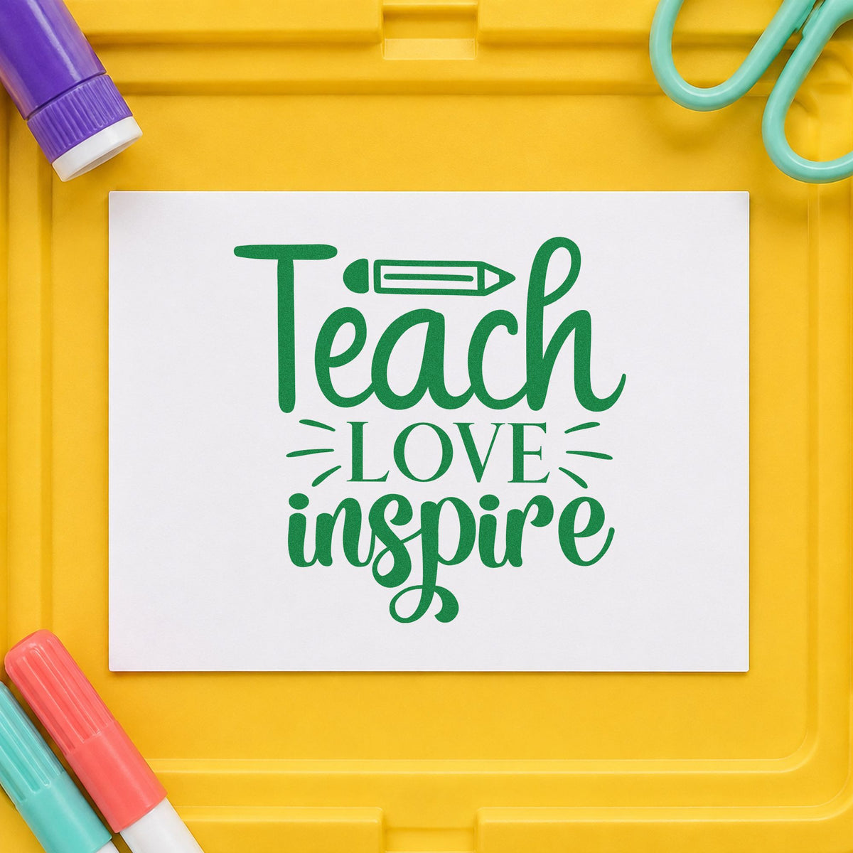 Teach Love Inspire Pencil craft stamp imprint in green ink on a handmade project, one idea being handwriting pages.
