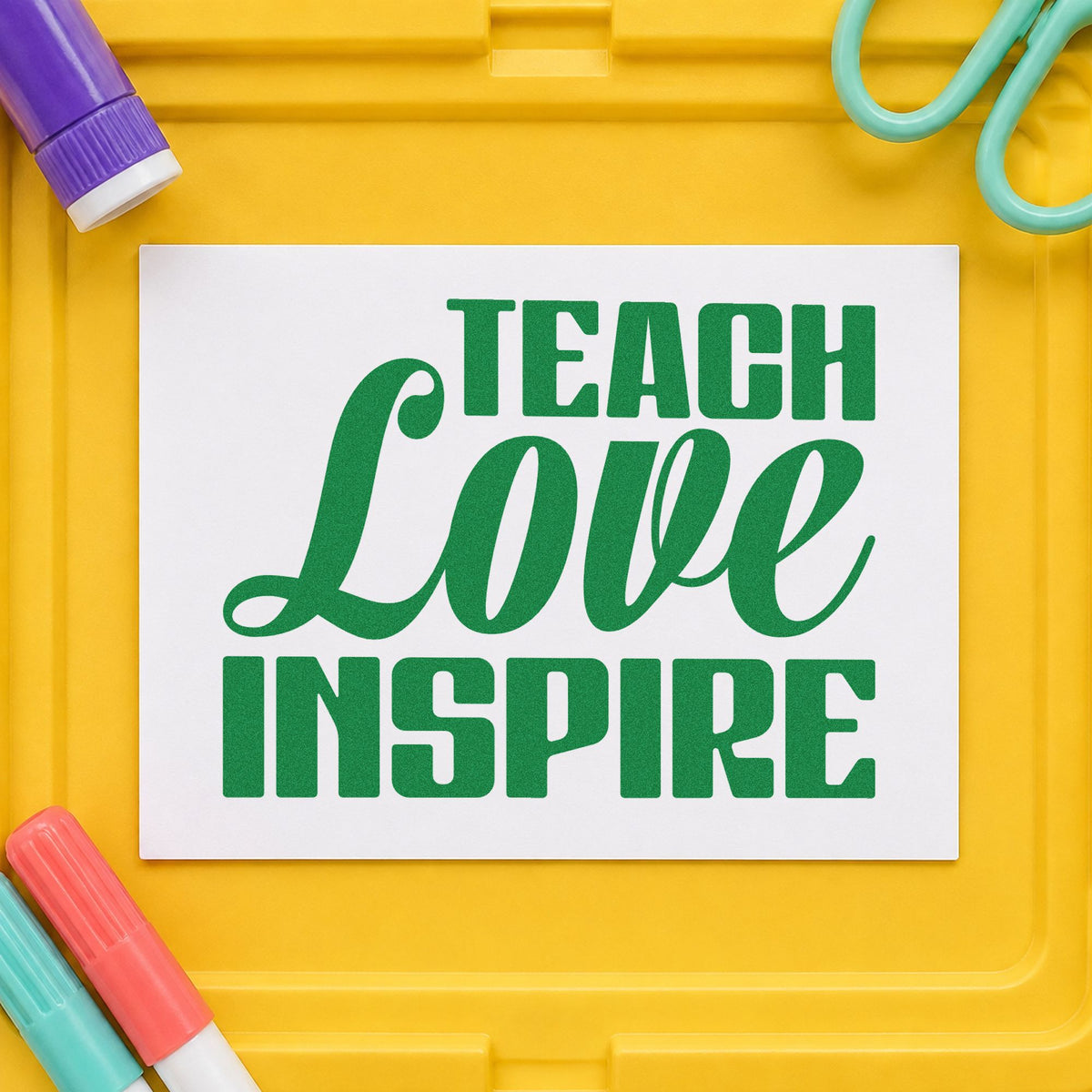 Teach Love Inspire Bold Script craft stamp imprint in green ink on a handmade project, one idea being framed couple print.