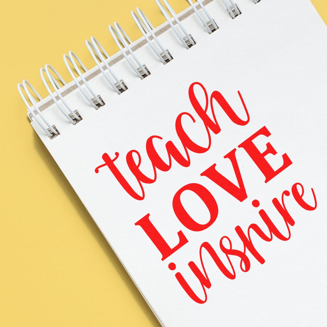 Teach Love Inspire Simple Script rubber stamp shown in red ink, stamped for projects such as certificate tags.