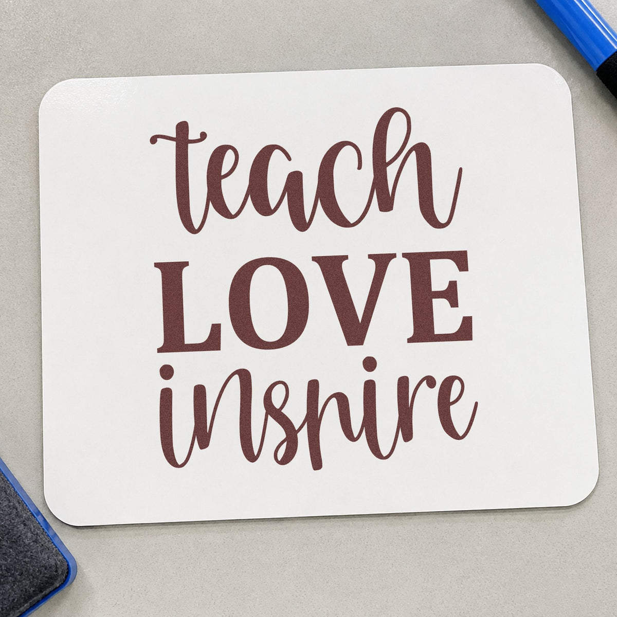 Teach Love Inspire Simple Script rubber stamp printed in brown ink, ready for folder spine labels and similar paper crafts.