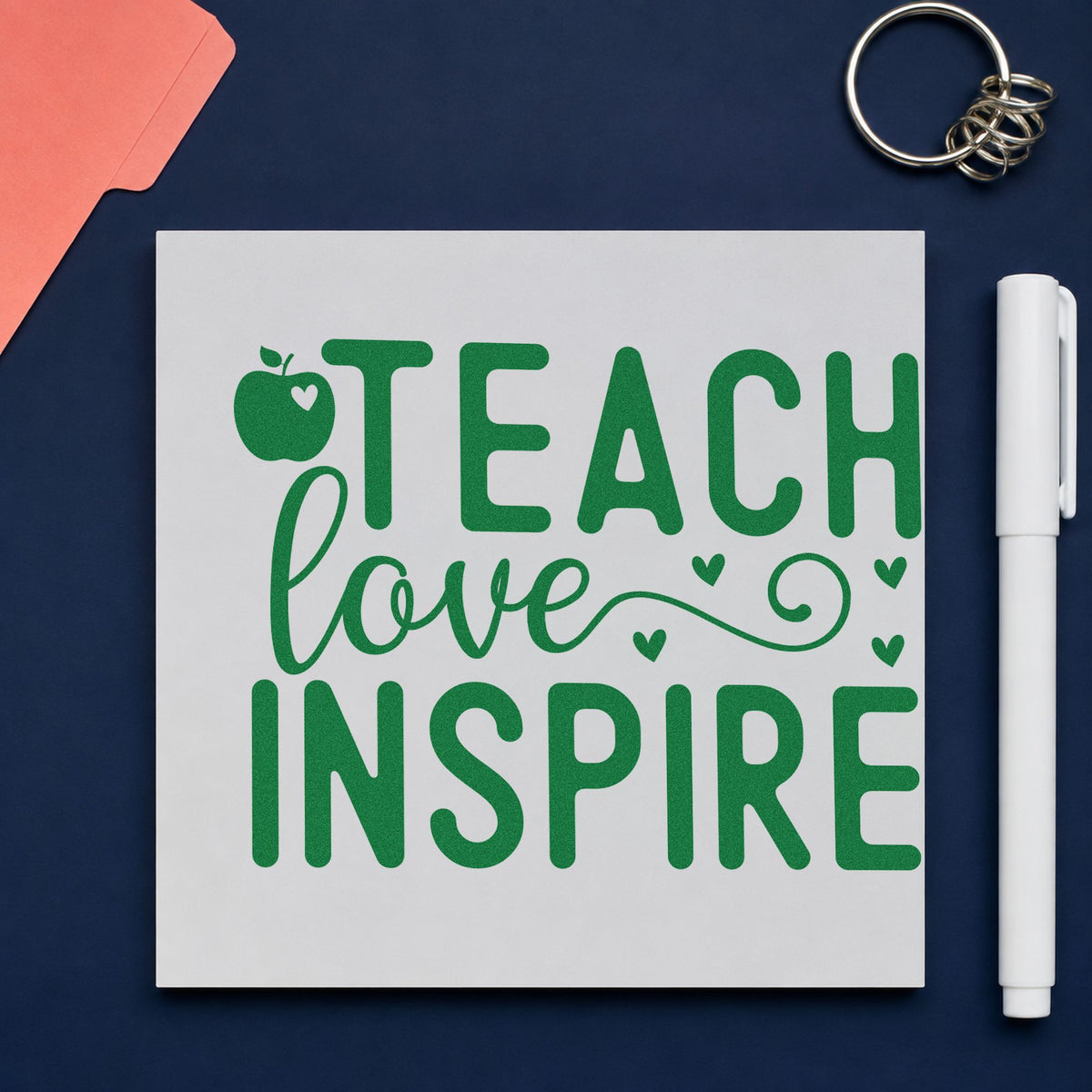 Teach Love Inspire Apple Hearts craft stamp imprint in green ink on a handmade project, one idea being framed garden shed.