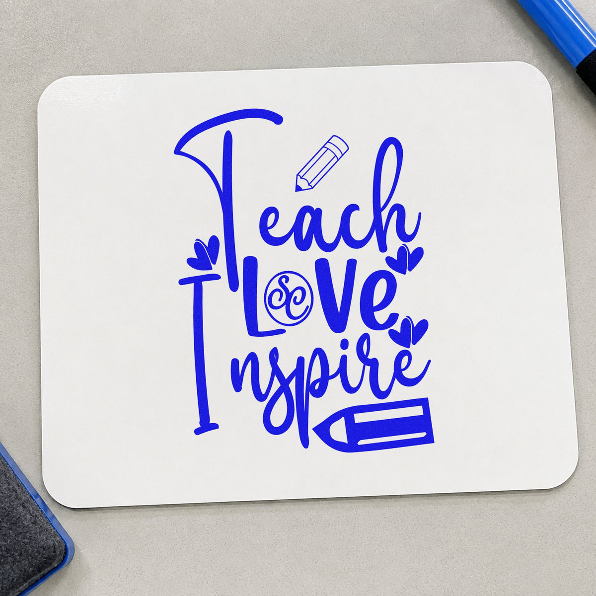 Teach Love Inspire Pencil Flourish craft stamp in blue ink on cardstock, an easy option for sleeve cuff panels.