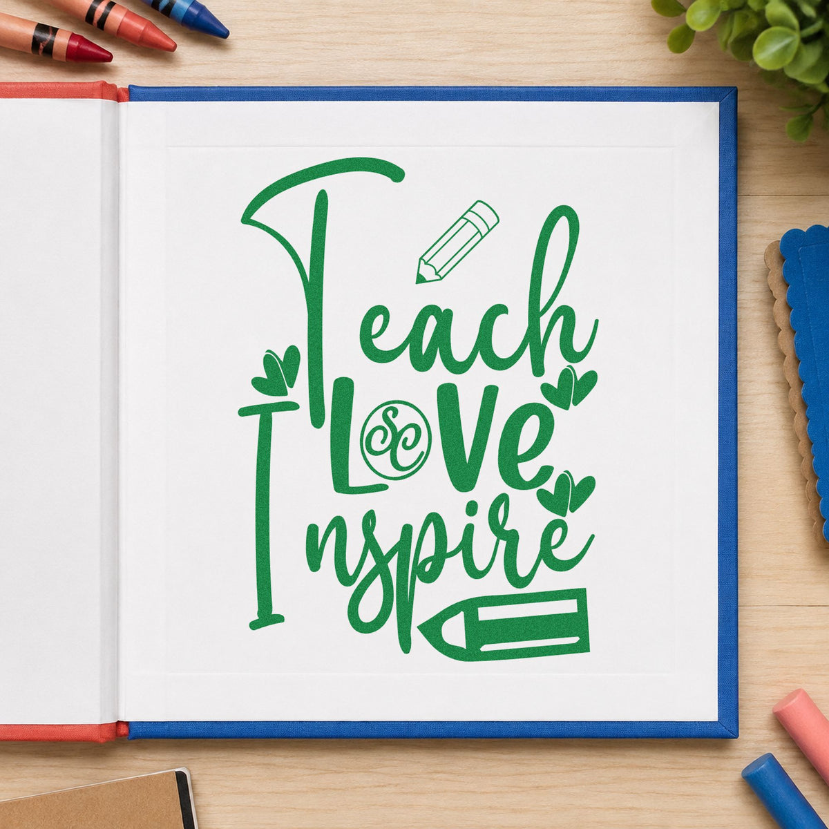 Teach Love Inspire Pencil Flourish craft stamp imprint in green ink on a handmade project, one idea being framed letter study.