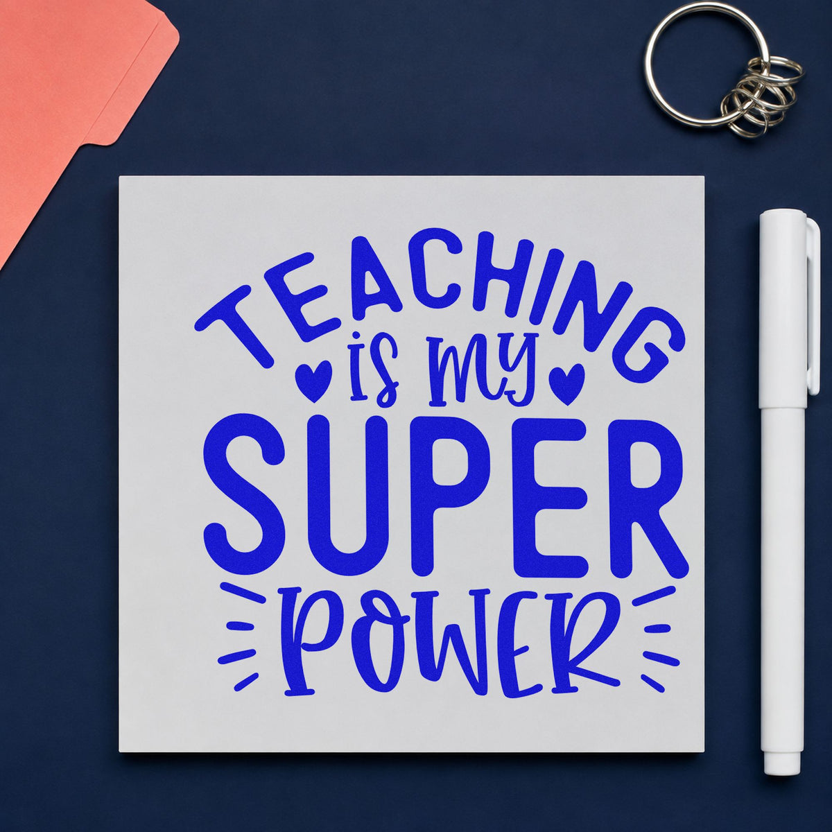 Teaching Is My Super Power craft stamp in blue ink on cardstock, an easy option for cardigan cuff panels.