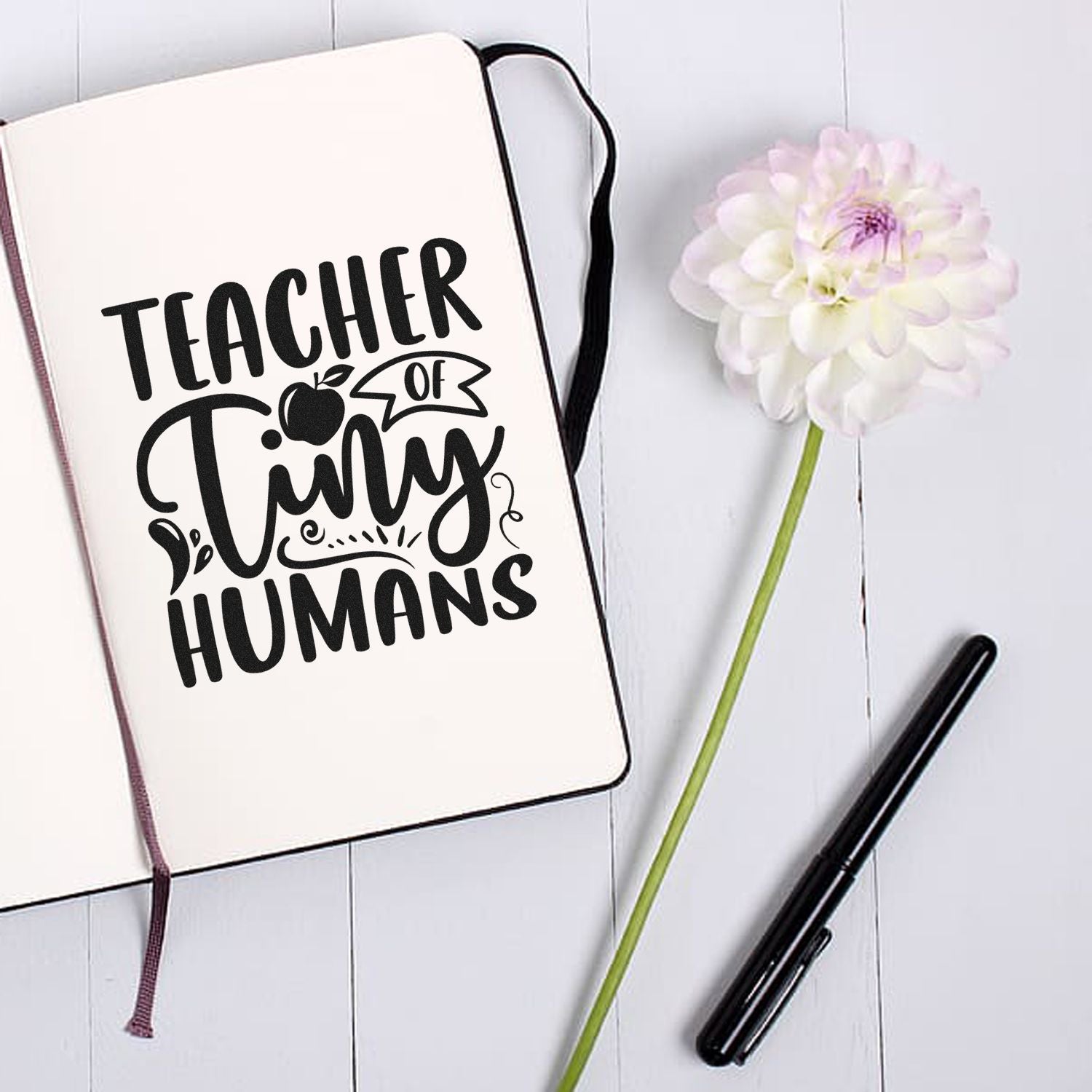 Teacher of Tiny Humans rubber stamp design on notebook, perfect personalized teacher gift.