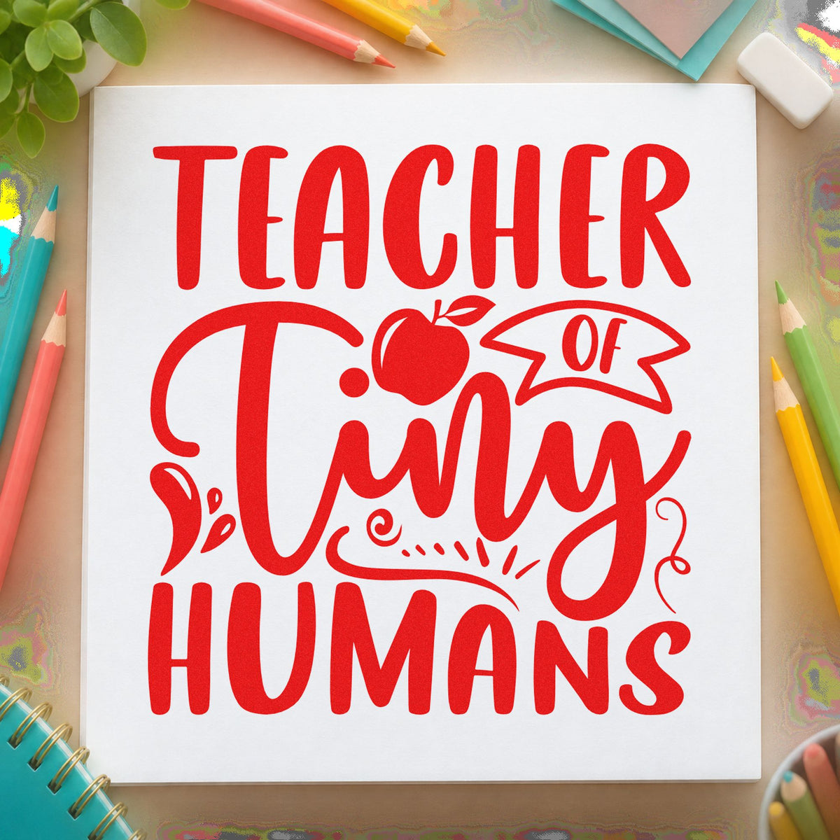 Teacher Of Tiny Humans Apple rubber stamp shown in red ink, stamped for projects such as naming day notes.
