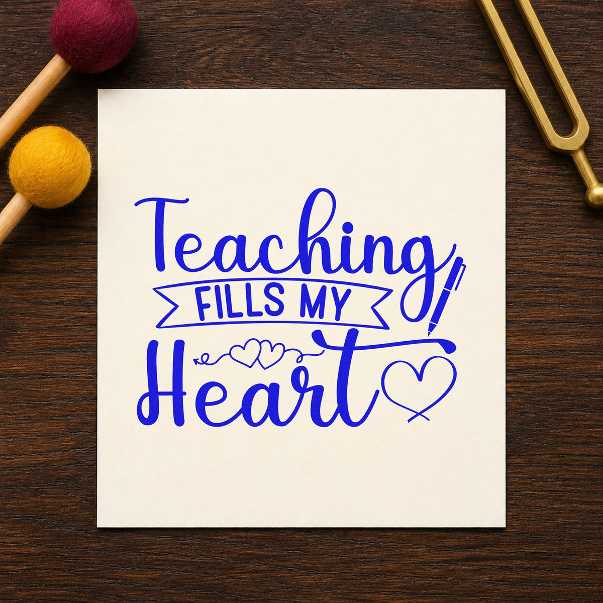 Teaching Fills My Heart craft stamp imprinted in blue ink on paper, a design suited to posy stem seals.